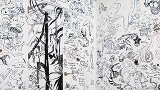 A wall of hand-drawn, black-and-white fish