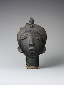 A black terracotta sculpture of a human head