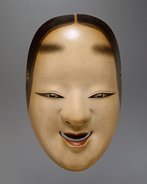 A mask of a female head with exaggerated features