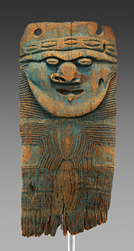 A long wooden board with a face with exaggerated features